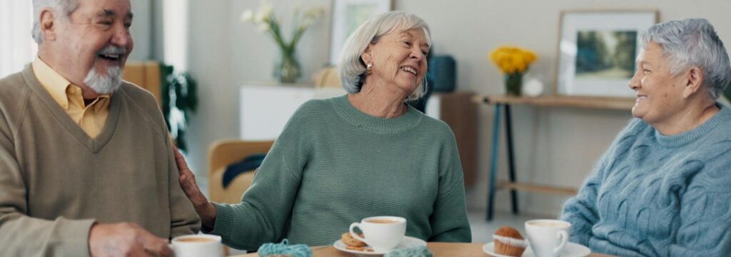 Tea, old people or friends in retirement talking for support, care or trust for bonding together in